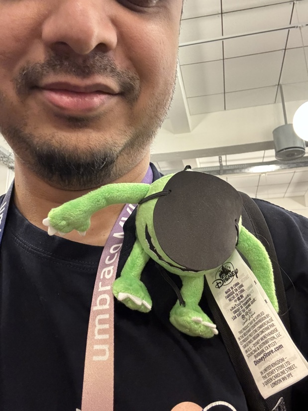 Matthew Hart with a small Mike Wazowski from Monsters Inc on his shoulder wearing an eye patch