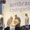 Man winning a giant cheese wheel on the Umbraco Codegarden stage